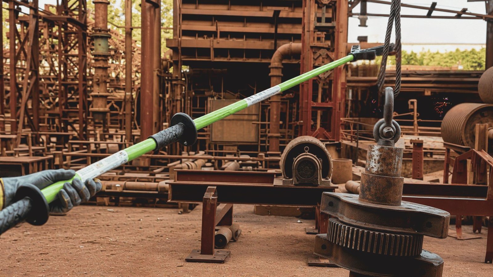 Illustration of a load guidance pole contacting an industrial component